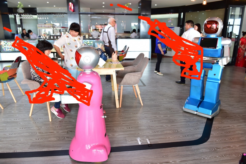 Illustration for article titled Are China's Robot Restaurants a Threat To American National Security?